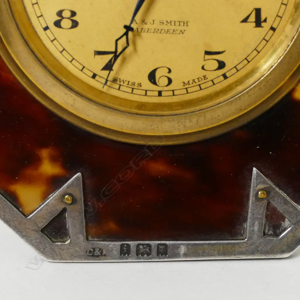 An Art Deco silver mounted tortoiseshell strut back desk clock Image 1++