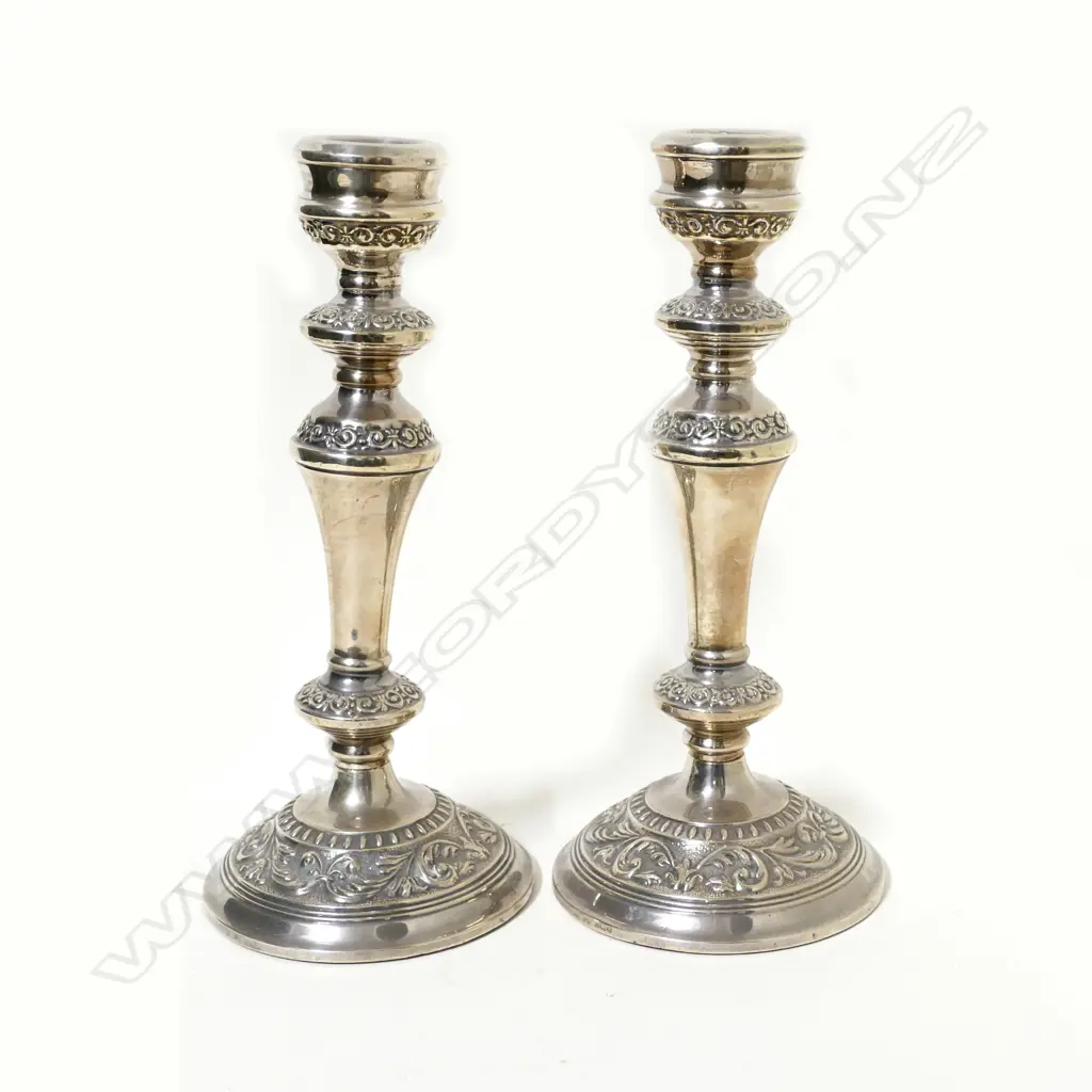 A pair of silver candlesticks Image 1++