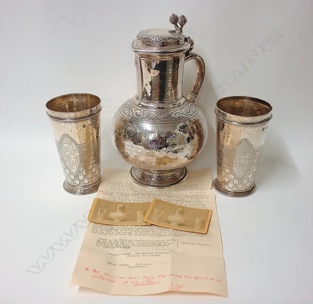 A large heavy and impressive Victorian presentation silver jug and two beakers Image 1++