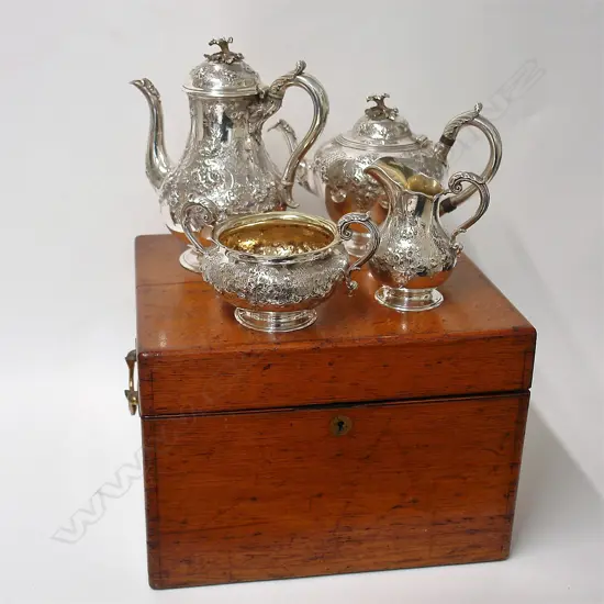 An impressive Victorian silver oak boxed four-piece tea and coffee service