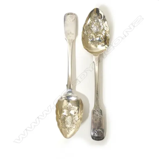 A pair of George III silver berry spoons