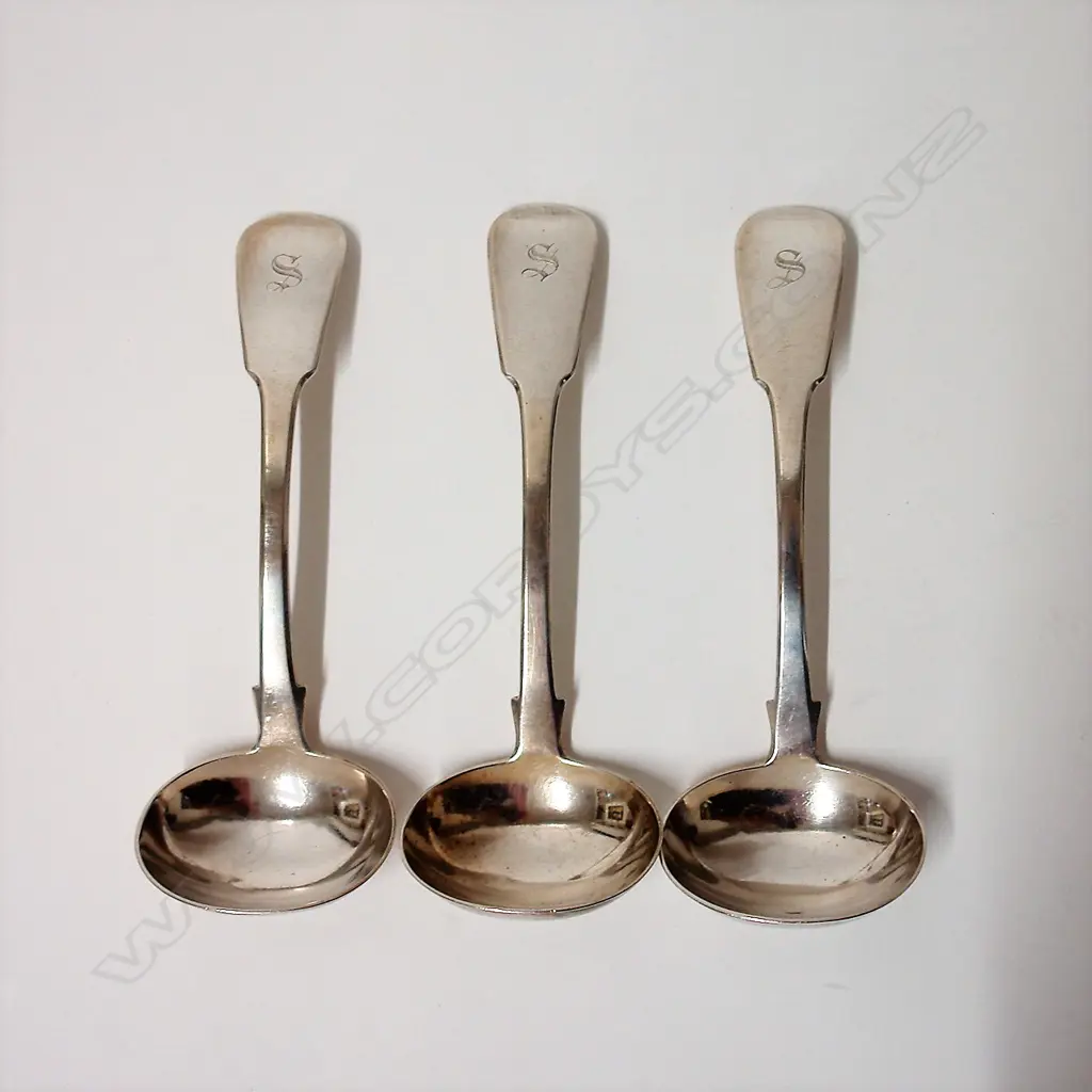 A set of three George III silver sauce ladles Image 1++
