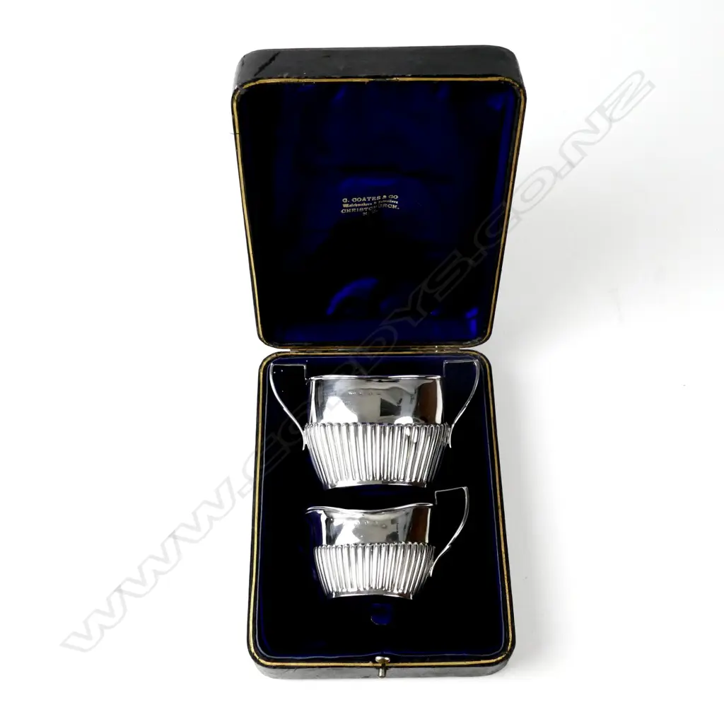 A boxed set of late Victorian silver cream and sugar Image 1++