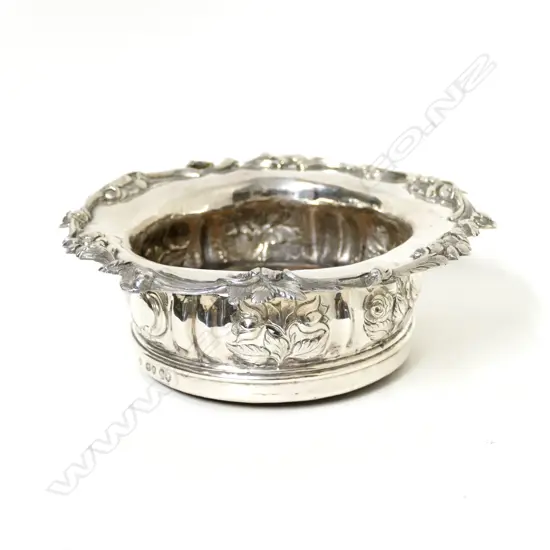 An early Victorian silver bottle coaster