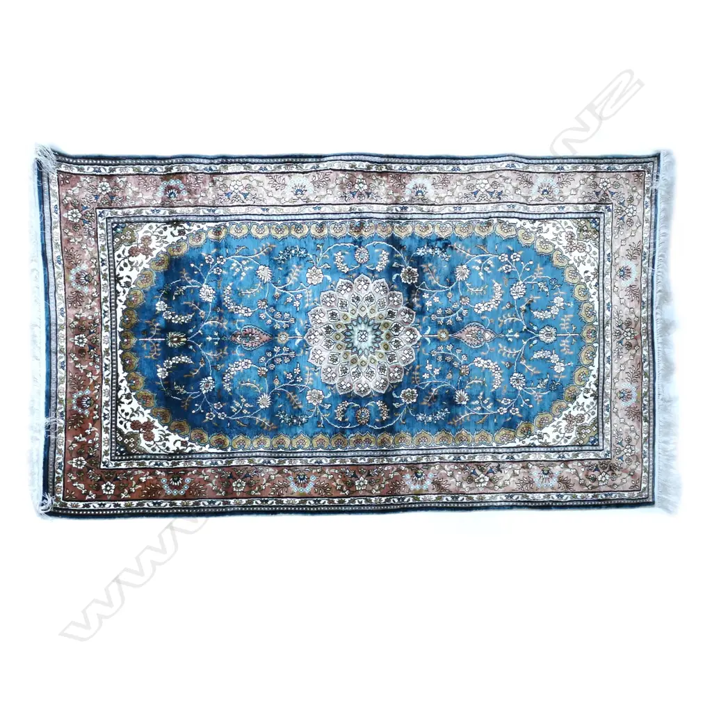 A small fine quality hand-knotted silk rug Image 1++