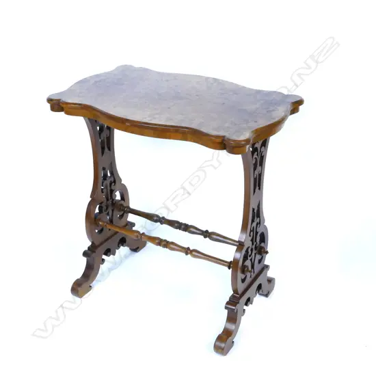 A small Victorian burr walnut serpentine side table
