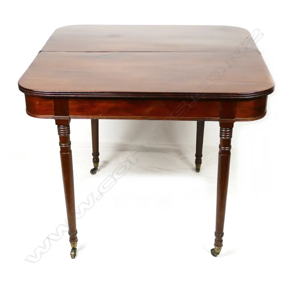 A Georgian mahogany flap-top tea table Image 1++