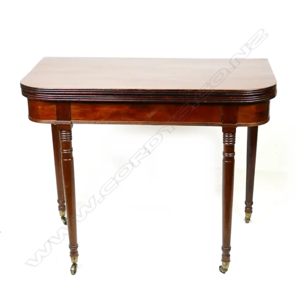 A Georgian mahogany flap-top tea table Image 1++