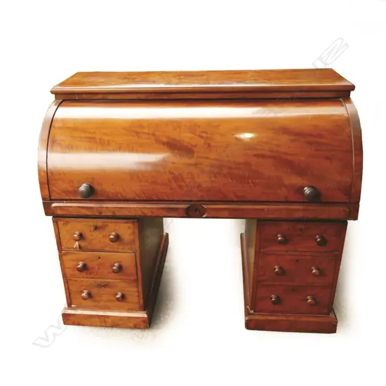A large William IV flame mahogany cylinder desk