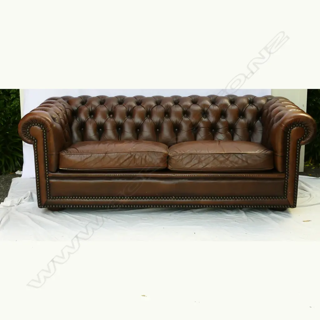 A leather two-seater button-back Chesterfield Image 1++