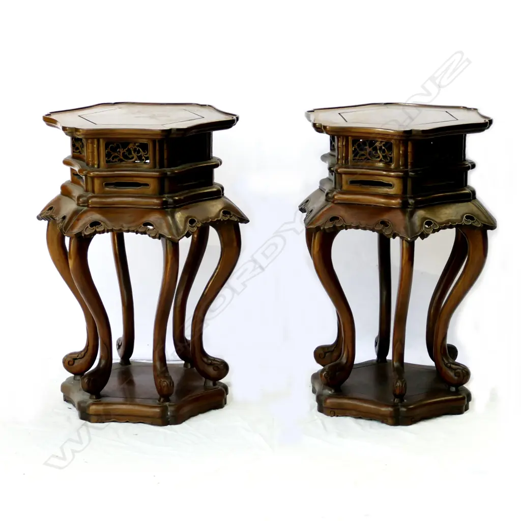 A pair of ornate Chinese rosewood vase stands Image 1++