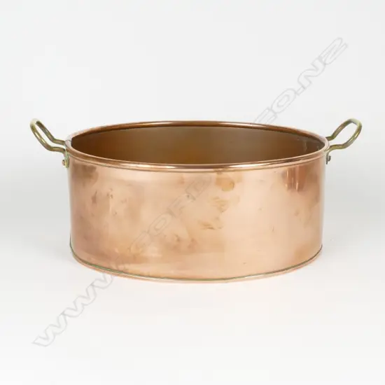 A large antique handmade copper pan