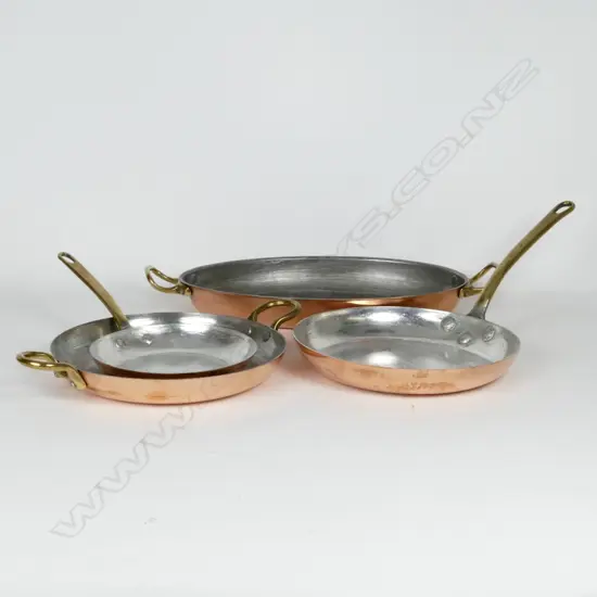 Four copper St Clair kitchen pans