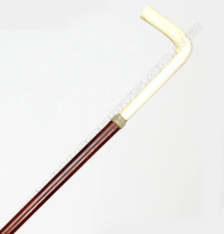 A malacca cane and ivory handled walking stick Image 1++