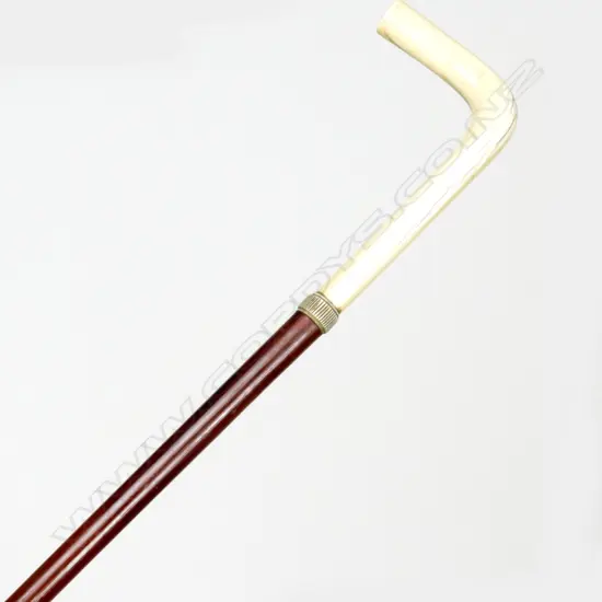 A malacca cane and ivory handled walking stick