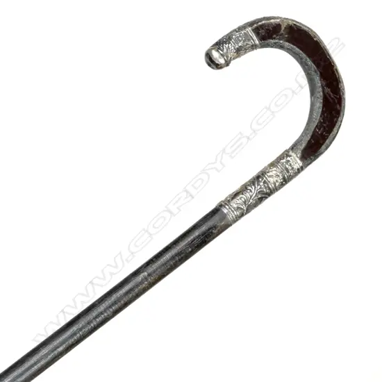 A vintage black walking cane