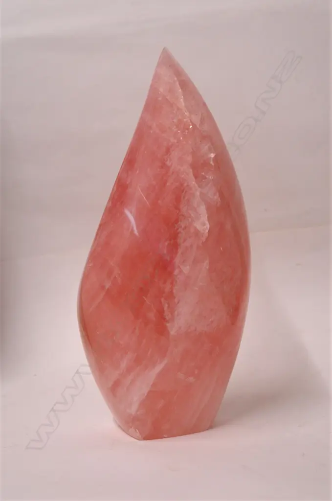 A polished natural rose quartz sculpture Image 1++