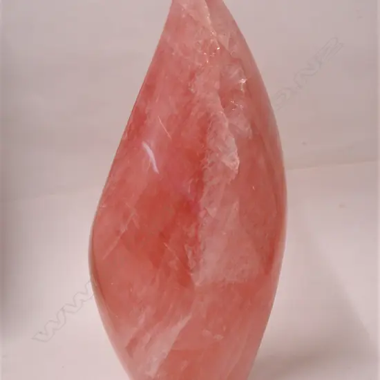A polished natural rose quartz sculpture
