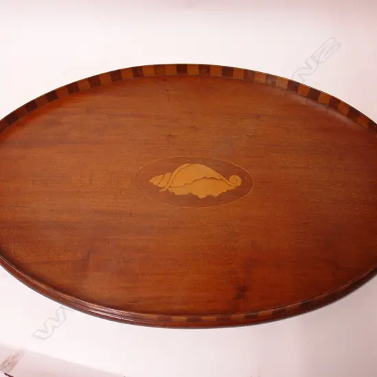 An Edwardian Sheraton Revival mahogany oval tray