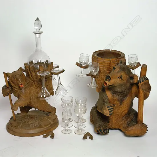 Two Black Forest carved decanter stands