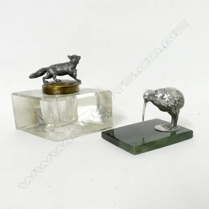 An antique paperweight with silver plated kiwi standing on a greenstone slab Image 1++