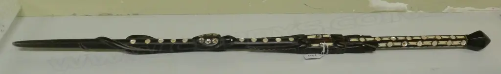An old Solomon Islands carved and inlaid walking stick Image 1++