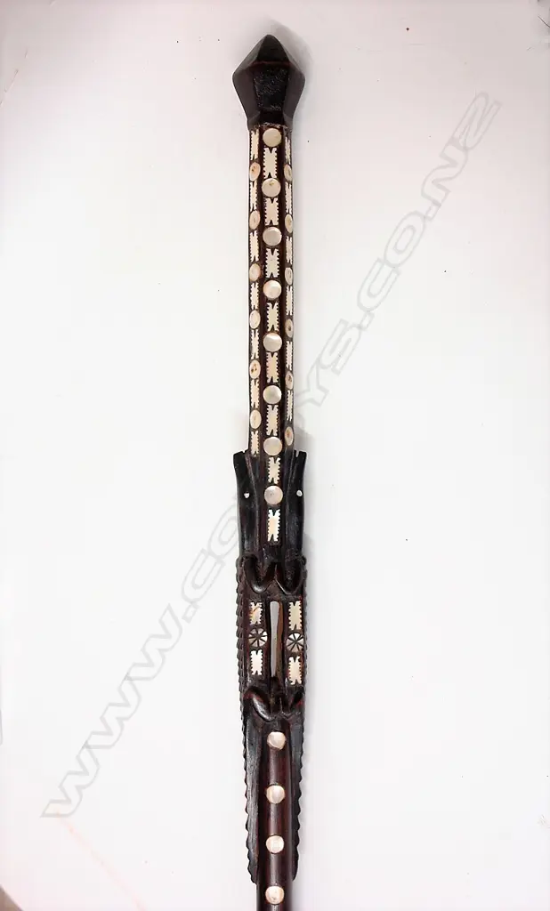 An old Solomon Islands carved and inlaid walking stick Image 1++