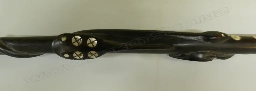 An old Solomon Islands carved and inlaid walking stick Image 1++