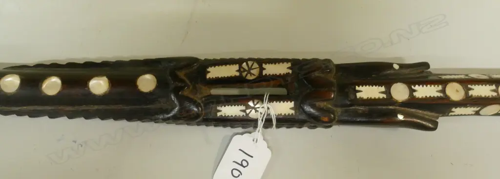 An old Solomon Islands carved and inlaid walking stick Image 1++