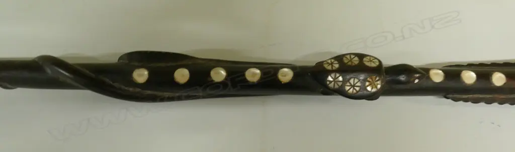 An old Solomon Islands carved and inlaid walking stick Image 1++