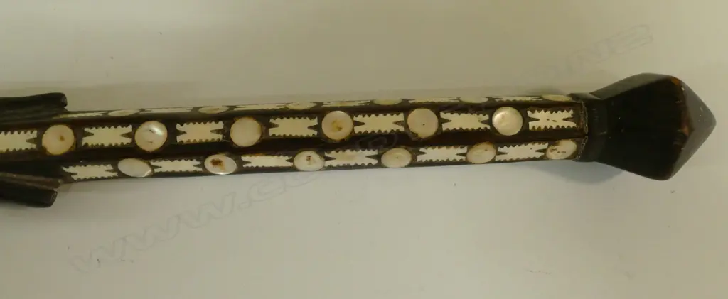 An old Solomon Islands carved and inlaid walking stick Image 1++