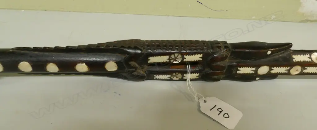 An old Solomon Islands carved and inlaid walking stick Image 1++