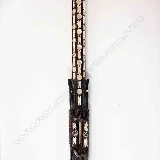 An old Solomon Islands carved and inlaid walking stick