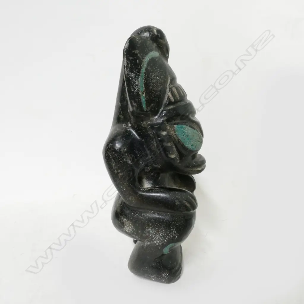 An archaic style black stone carved crouching beast Image 1++