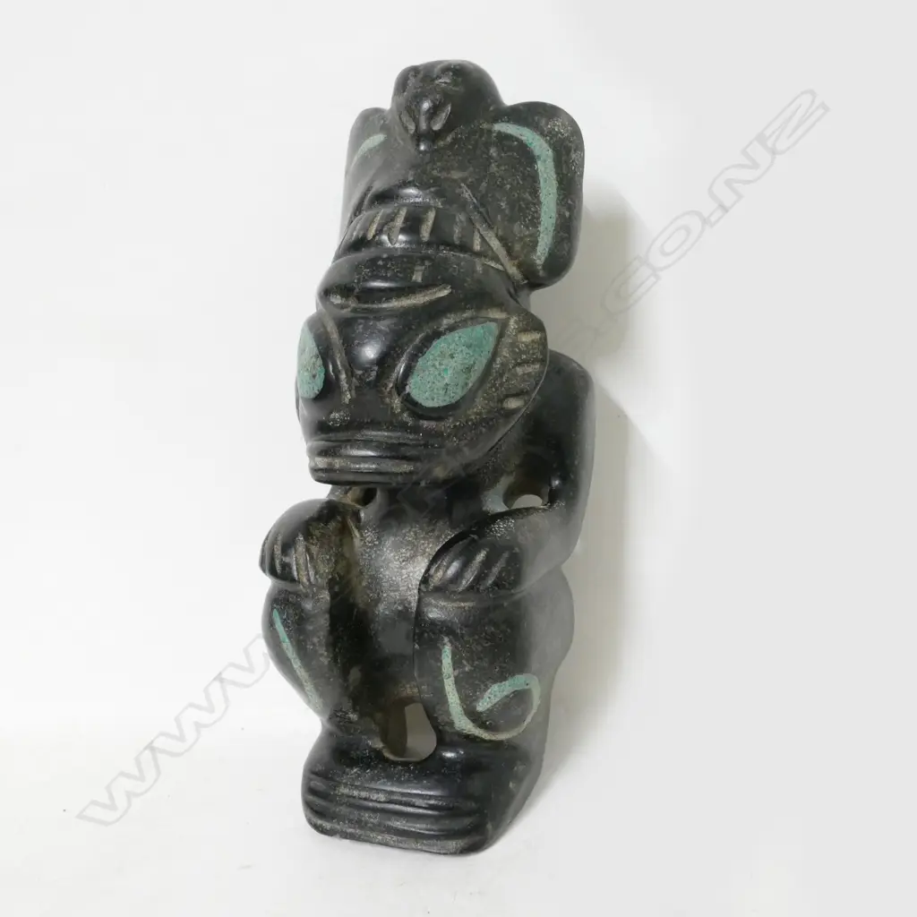 An archaic style black stone carved crouching beast Image 1++