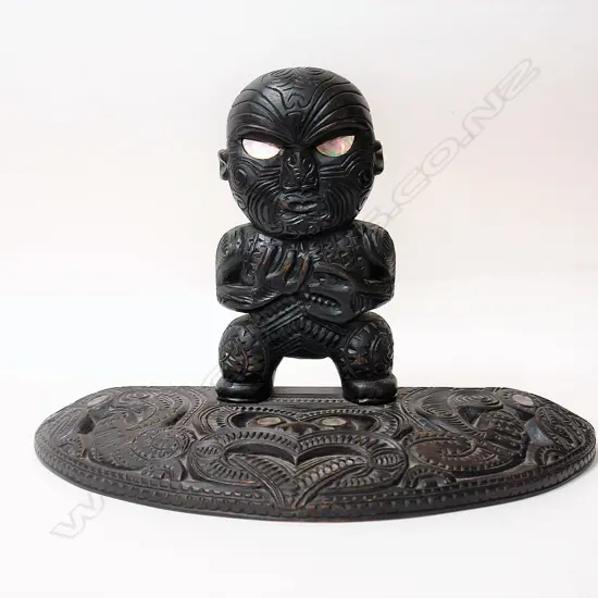 A historical WWII U.S. Navy-Maori carved presentation sculpture