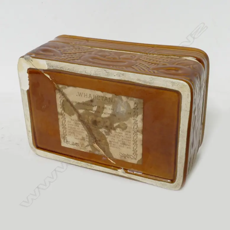 Crown Lynn Wharetana ware lidded trinket box of rectangular form decorated in the 'Rauponga Pattern' (#1002) the lid inscribed 'An Appreciation from George Harrison and Co Ltd...' Image 1++