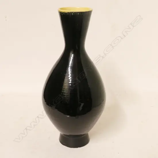 A hand potted Crown Lynn black vase