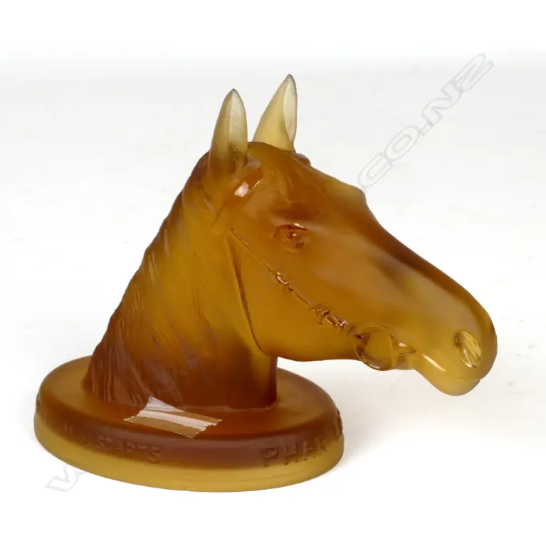 An amber depression glass paperweight Image 1++