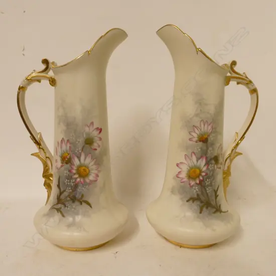 A pair of Royal Worcester ewer vases