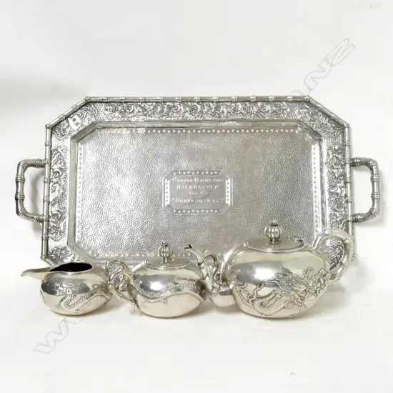 A Chinese silver tea set and accompanying tray