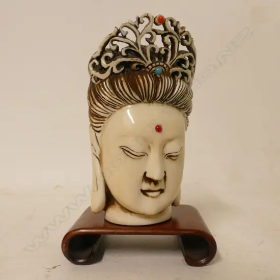 An ivory Buddha head