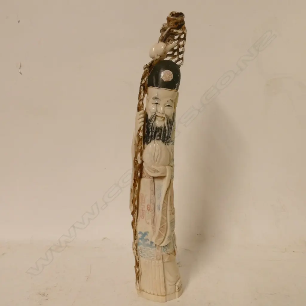 A carved ivory figurine of the god 'Shou Lao' Image 1++