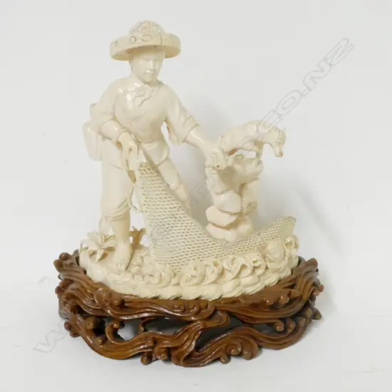A Chinese ivory carving of a fisherman