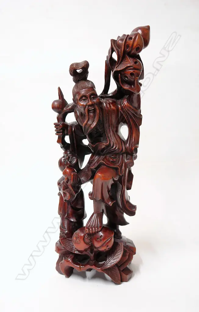 A Chinese carved wood figure of a sage Image 1++