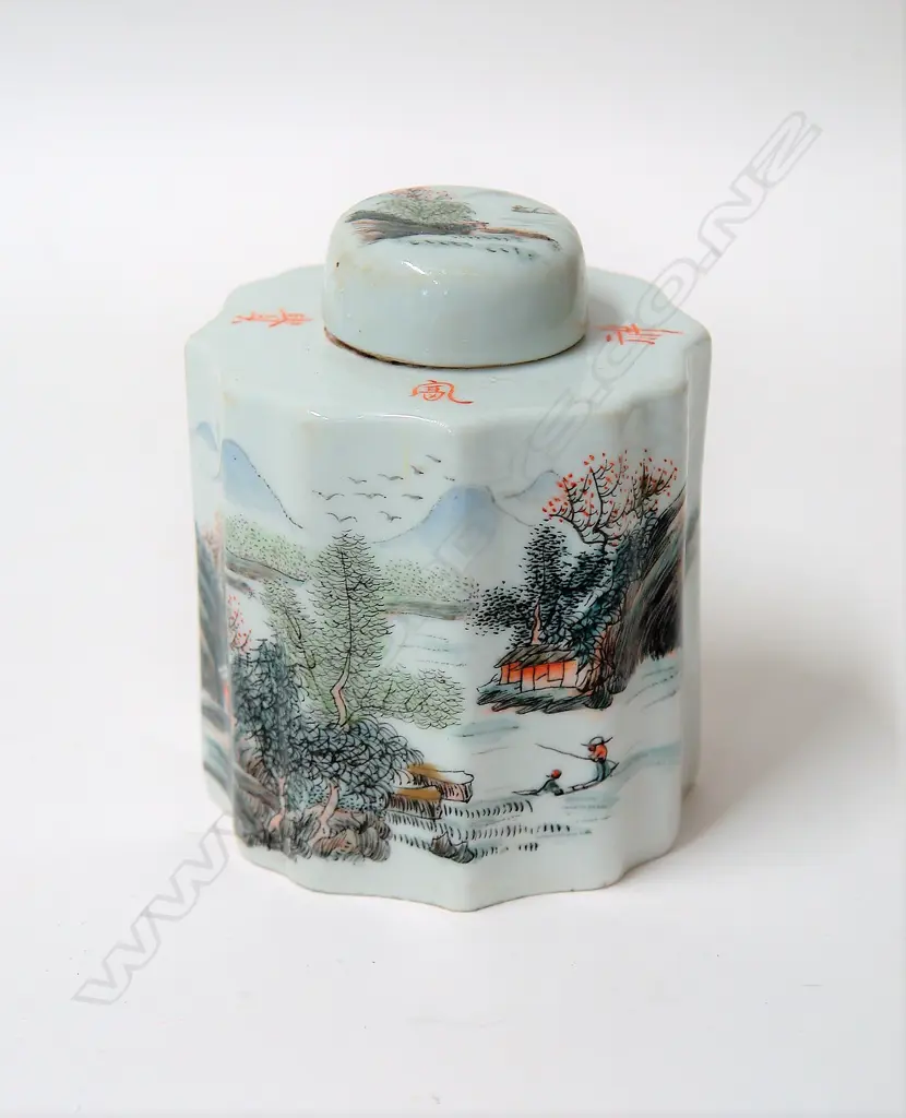 A Chinese porcelain tea caddy of cylindrical shape with a serpentine outline decorated with a landscape view and calligraphic inscription Image 1++