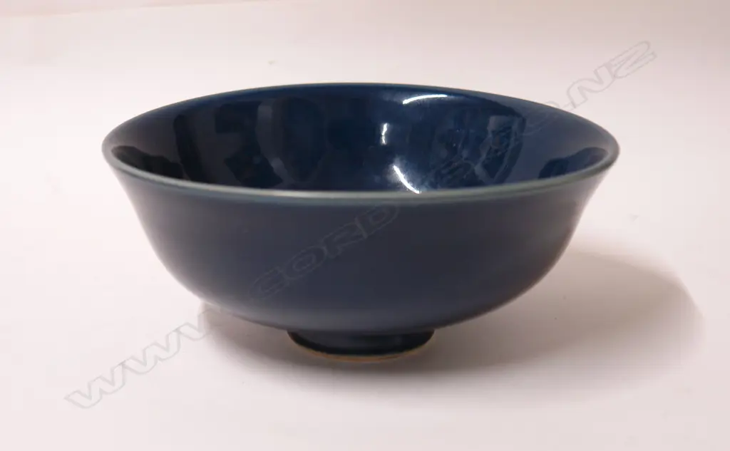 A Chinese monochrome blue glazed footed bowl Image 1++