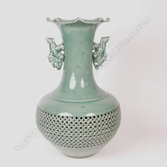 A large Japanese celadon reticulated two-handled vase