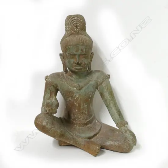 A metal seated Khmer temple figure