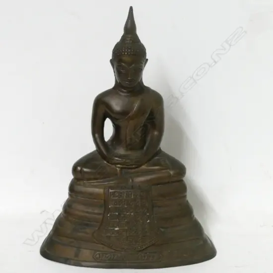 A small metal seated Buddha
